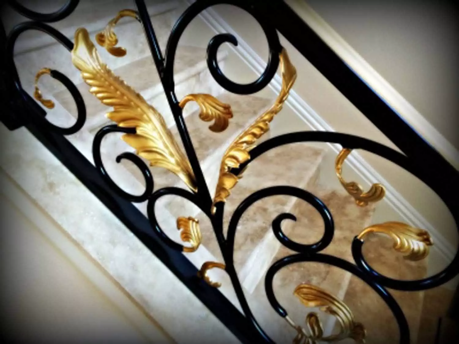 ornate bannister with gold leaf trim